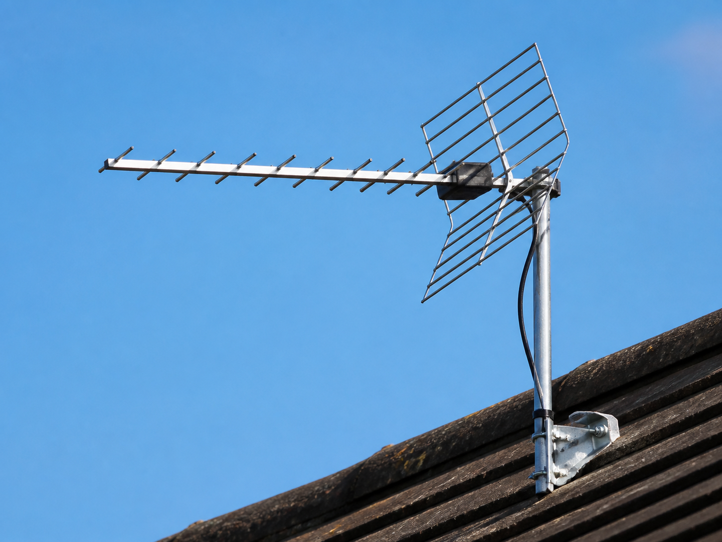 Aerial installation TV antenna mounted on residential roof
